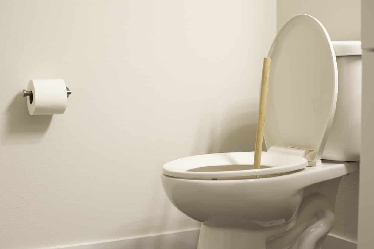 plunger-in-toilet-clogged-sewer-line